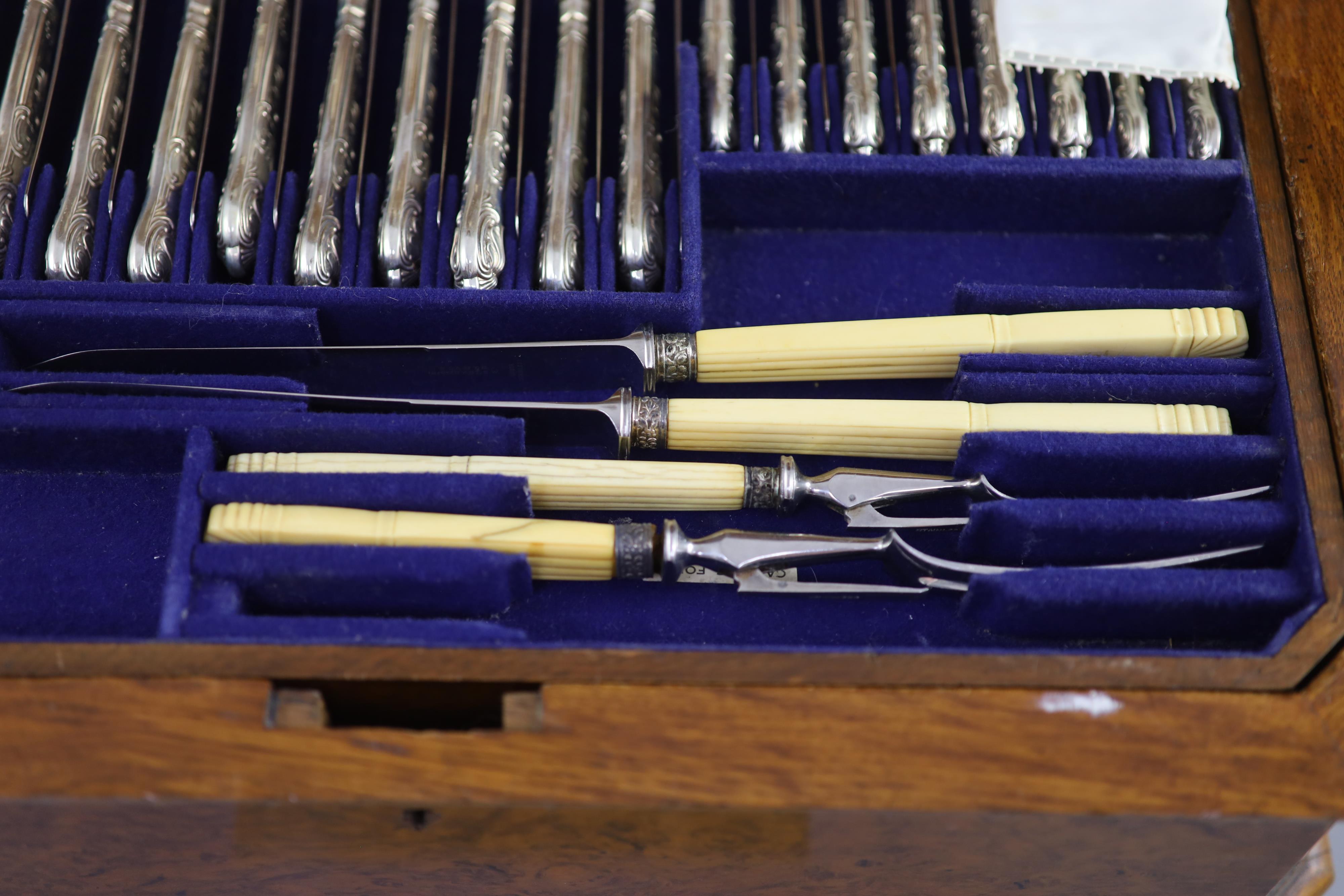 A part canteen of late Victorian silver double struck Queens pattern cutlery by Carrington & Co